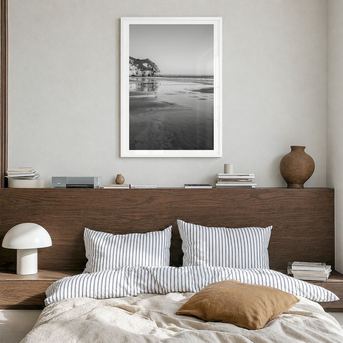 Avila Beach Photo Poster in a white wood frame, hanging in a bedroom, white border