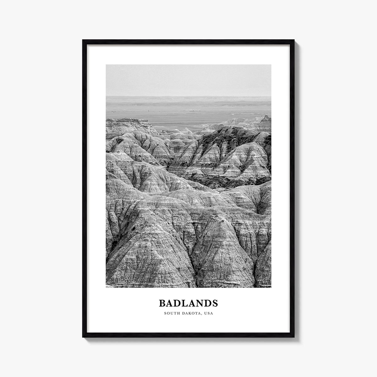 Badlands National Park black & white classic poster of South Dakota, USA – vertical wall art, unframed print shown in interio