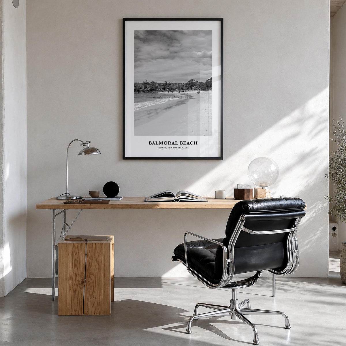Balmoral Beach black & white classic poster of Australia – vertical wall art in black wood frame, hanging on wall