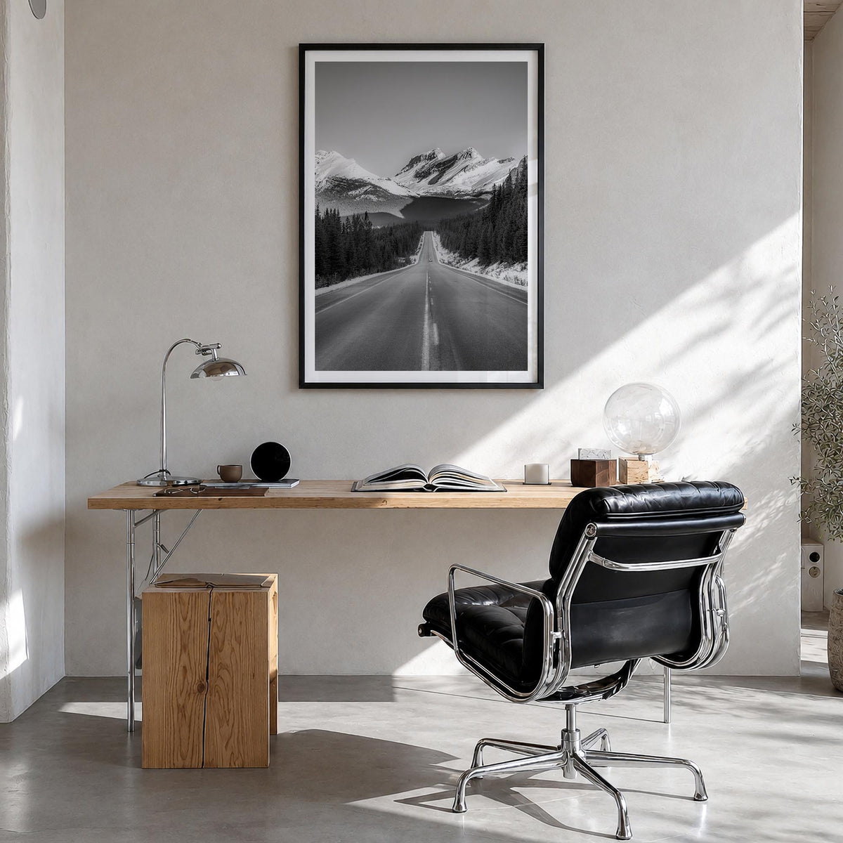 Banff black & white photo poster of Alberta, Canada – vertical wall art in black wood frame with white border, hanging on wal