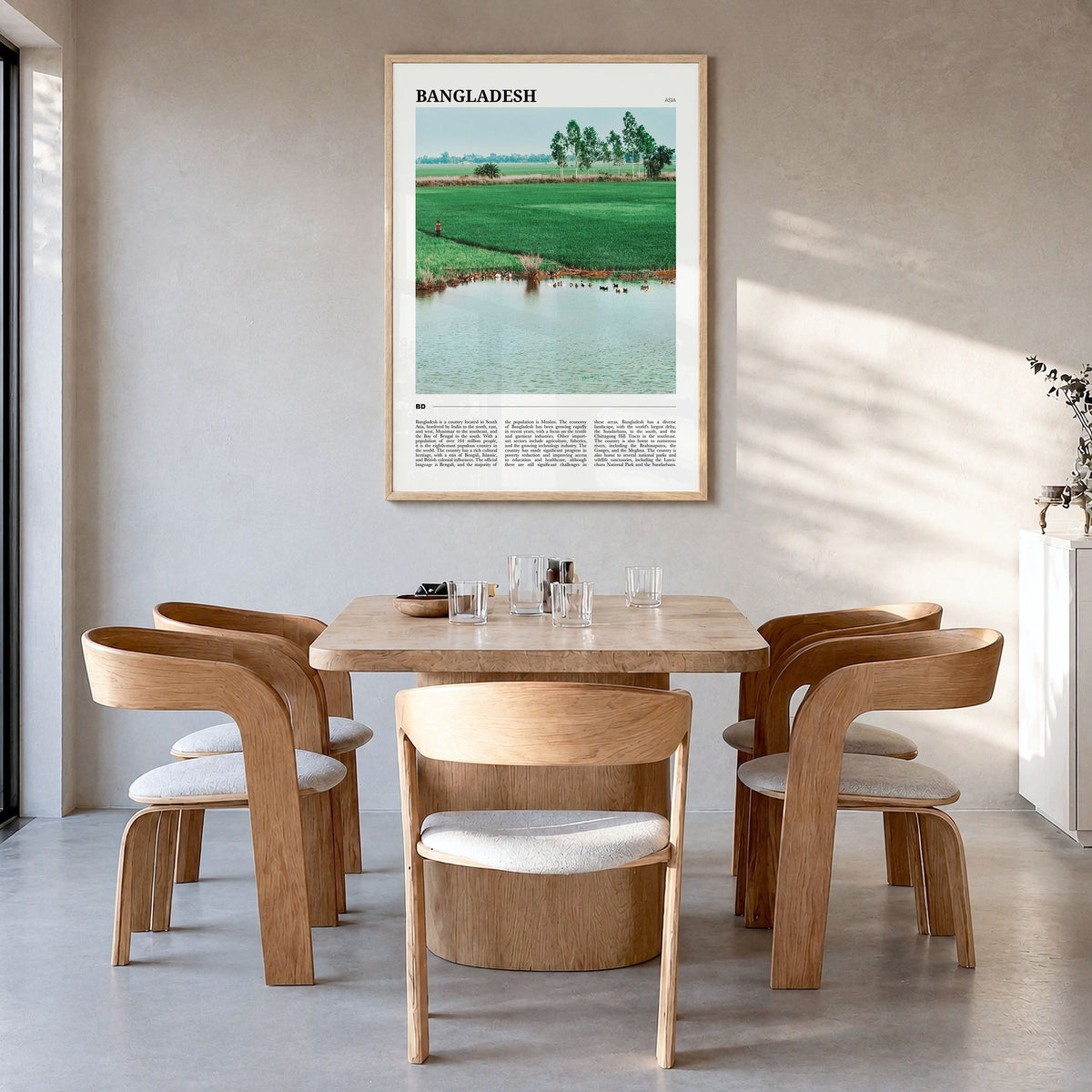 Bangladesh Travel Poster in a natural wood frame, hanging in a dining room