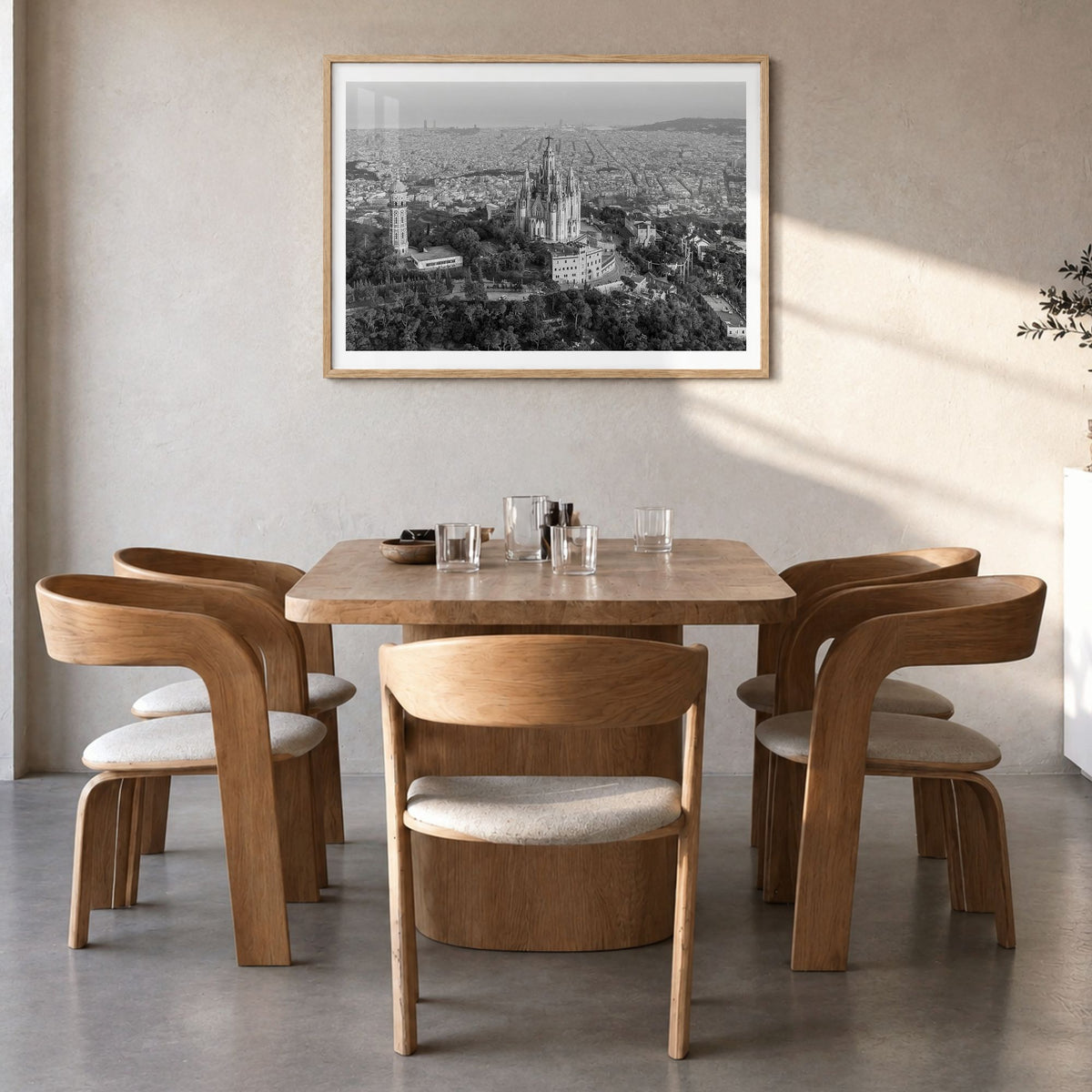 Barcelona Photo Poster in a natural wood frame, hanging in a dining room, white border