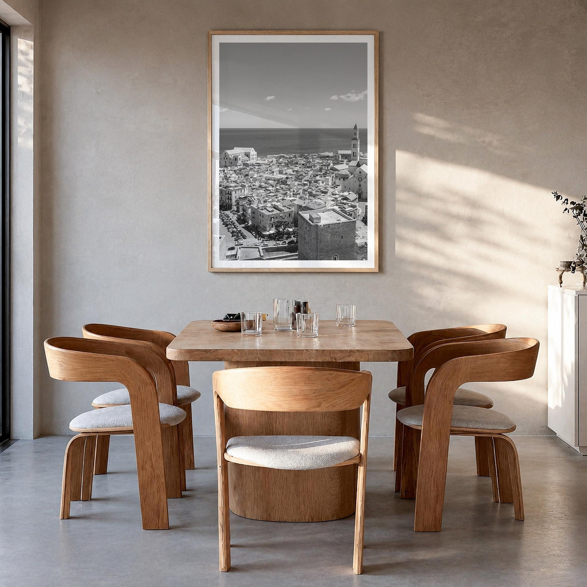 Bari black & white photo poster of Italy – vertical wall art in natural wood frame with white border, hanging on wall