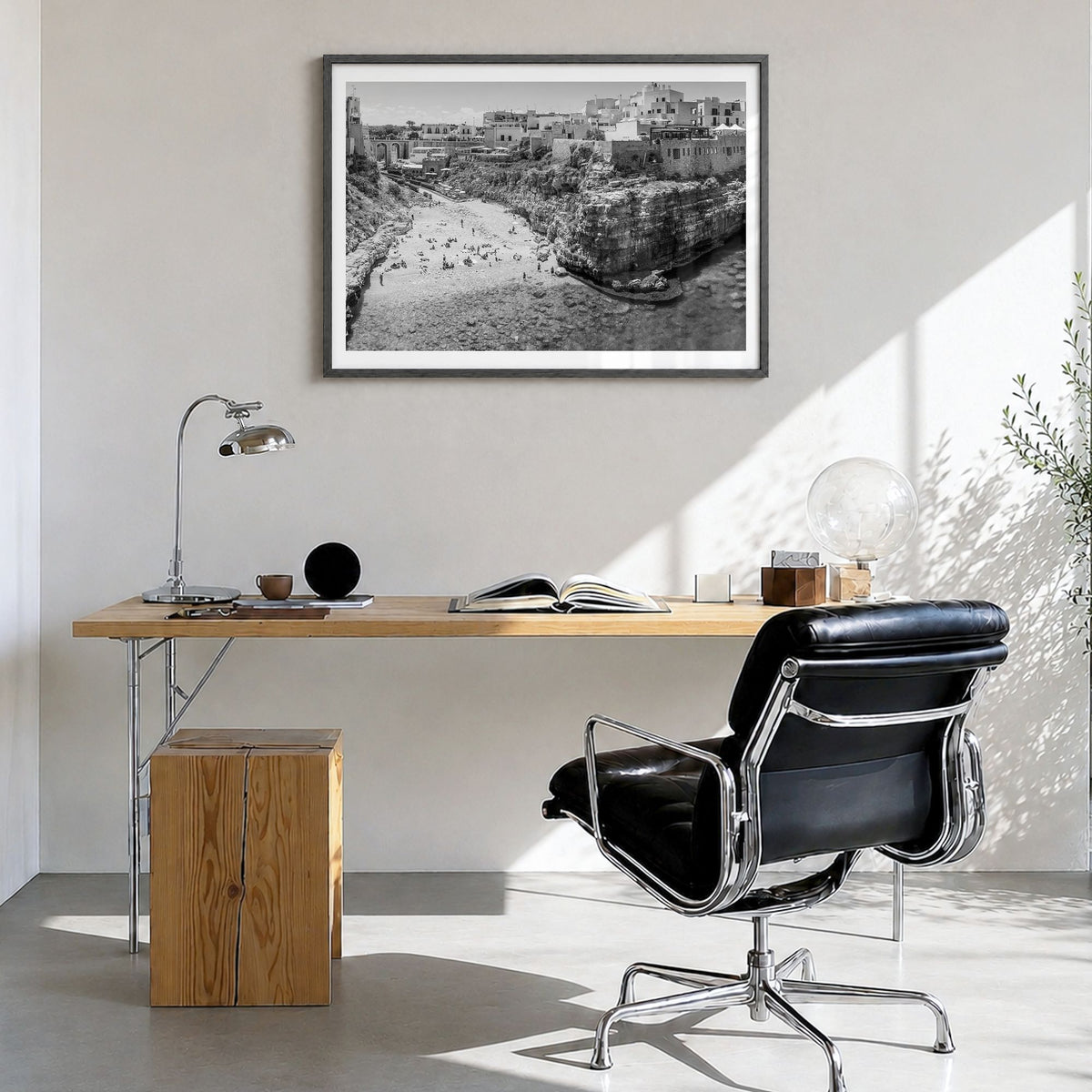 Bari Photo Poster in a black wood frame, hanging in a bright home office, white border