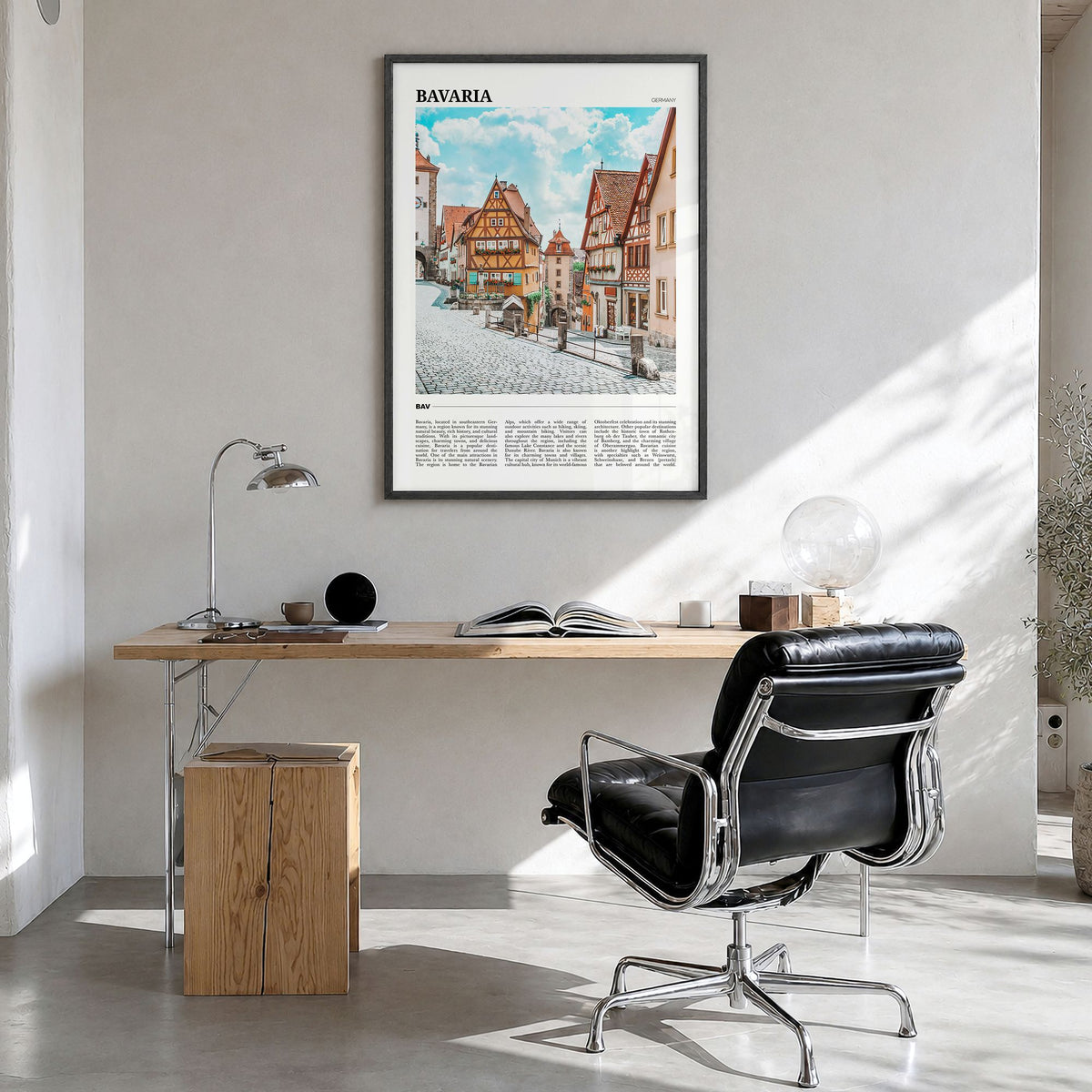 Bavaria Travel Poster in a black wood frame, hanging in a bright home office