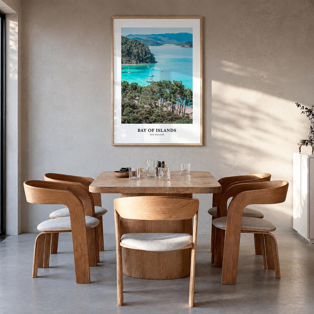 Bay of Islands colorful classic poster of New Zealand – vertical wall art in natural wood frame, hanging on wall