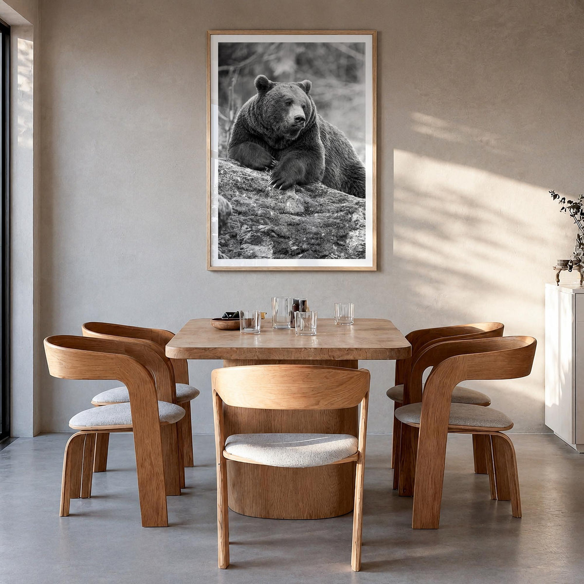Bear no. 1 black & white photo poster – vertical wall art in natural wood frame with white border, hanging on wall