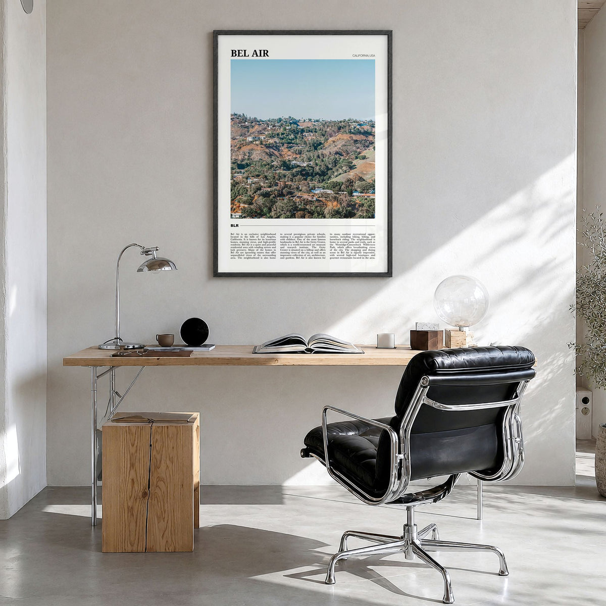 Bel Air Travel Poster in a black wood frame, hanging in a bright home office