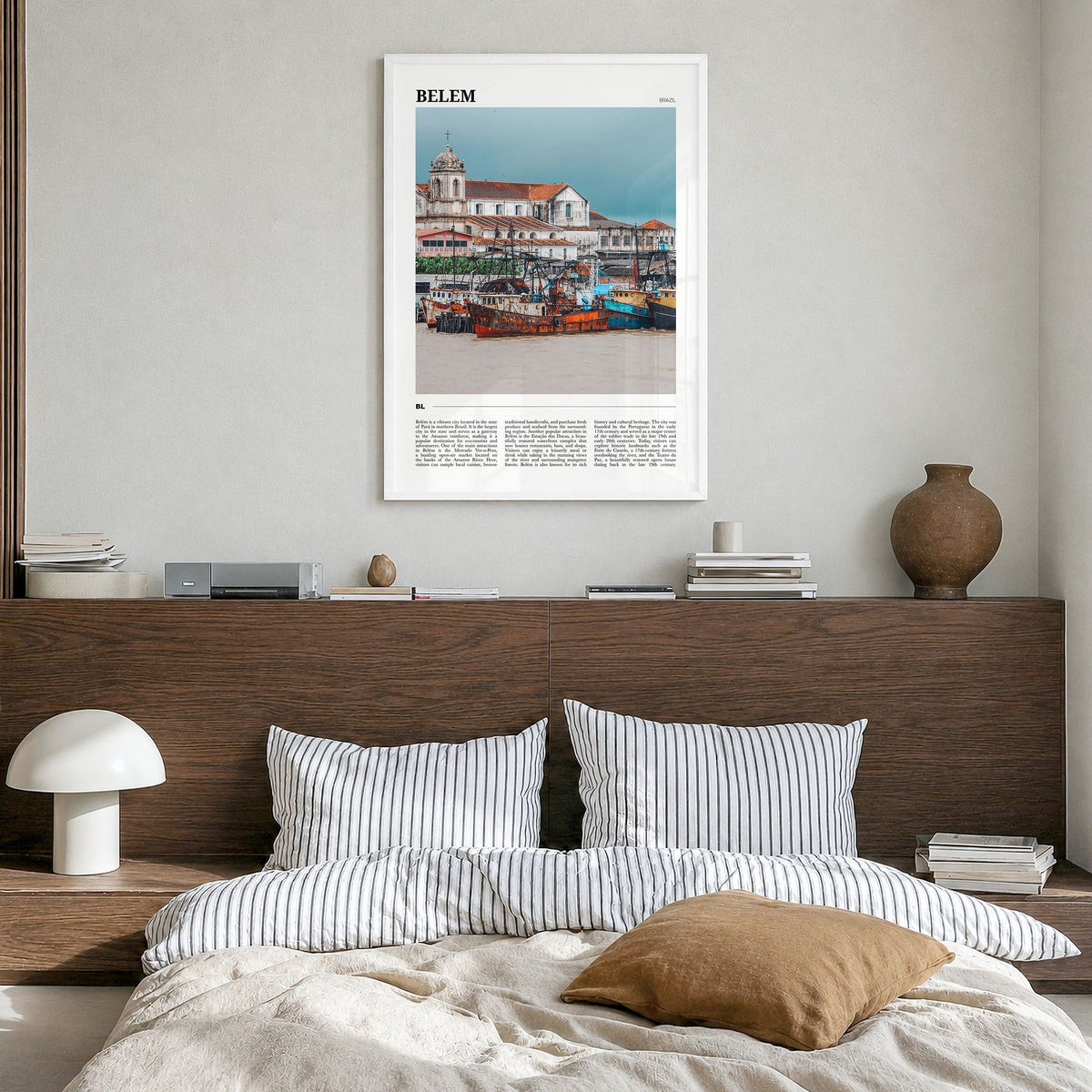 Belém Travel Poster in a white wood frame, hanging in a bedroom
