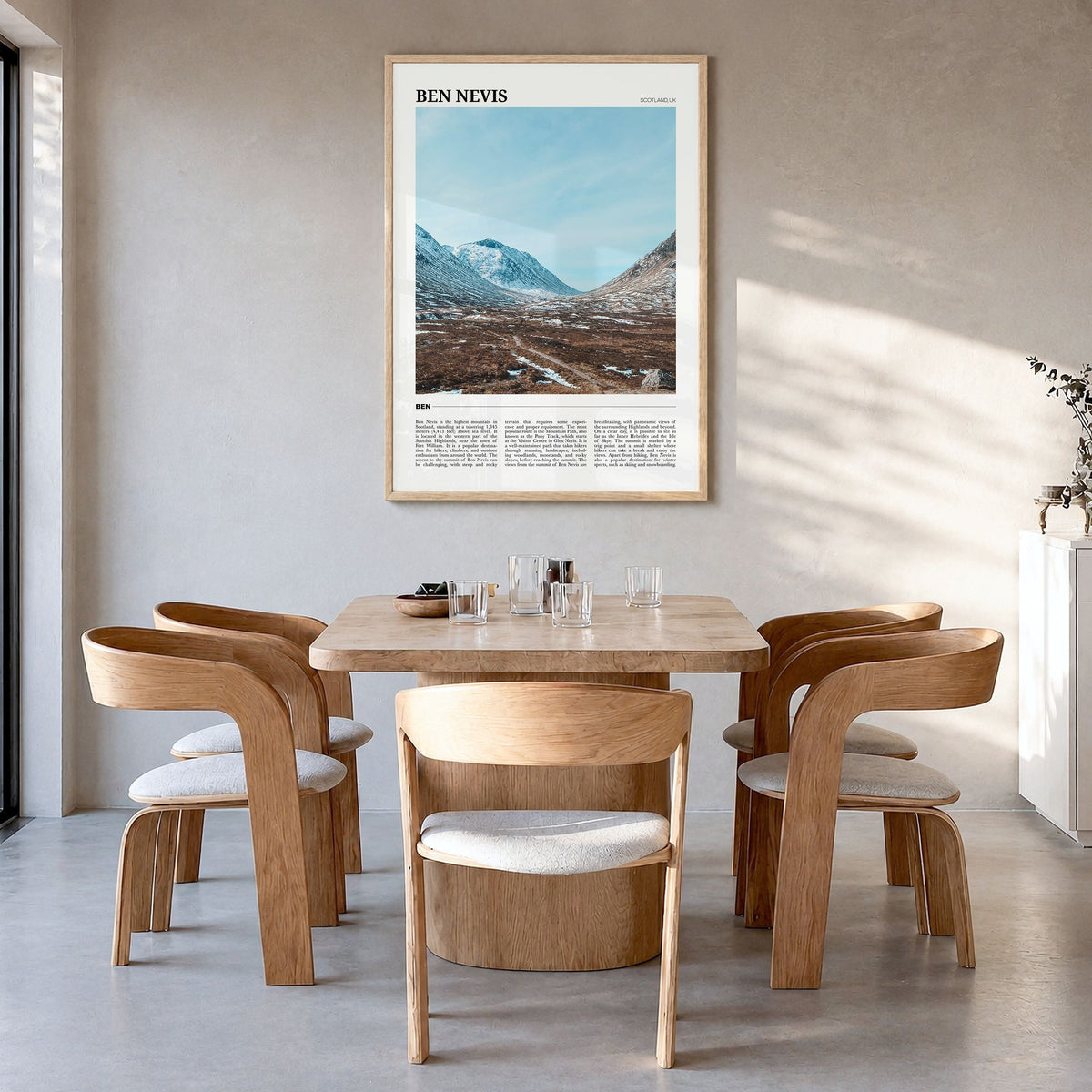 Ben Nevis Travel Poster in a natural wood frame, hanging in a dining room