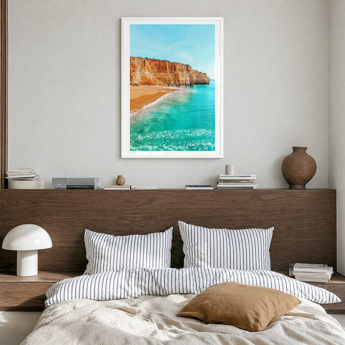 Benagil Beach Photo Poster in a white wood frame, hanging in a bedroom, white border