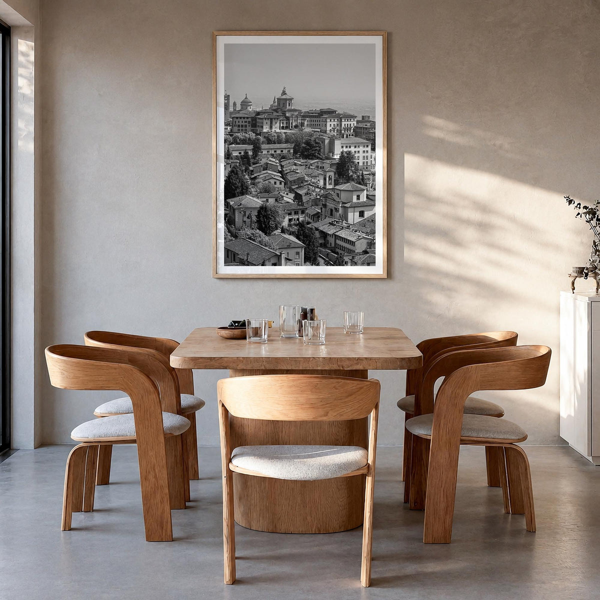 Bergamo black & white photo poster of Italy – vertical wall art in natural wood frame with white border, hanging on wall