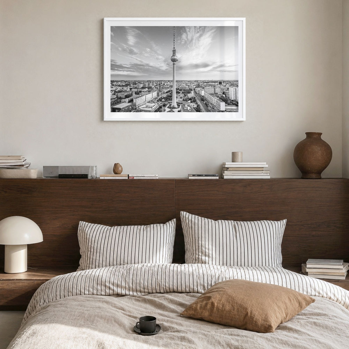 Berlin Photo Poster in a white wood frame, hanging in a bedroom, white border