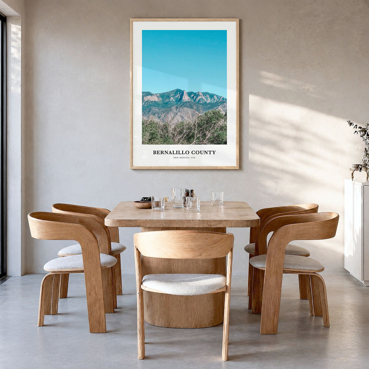 Bernalillo County Classic Poster in a natural wood frame, hanging in a dining room