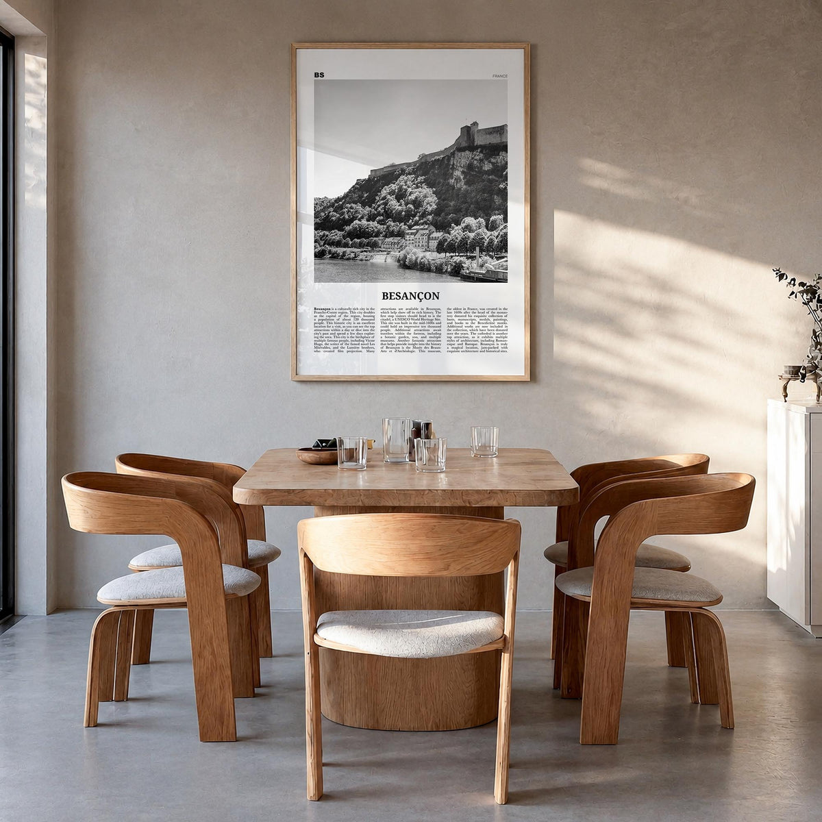 Besançon black & white newspaper poster of France – vertical wall art in natural wood frame, hanging on wall