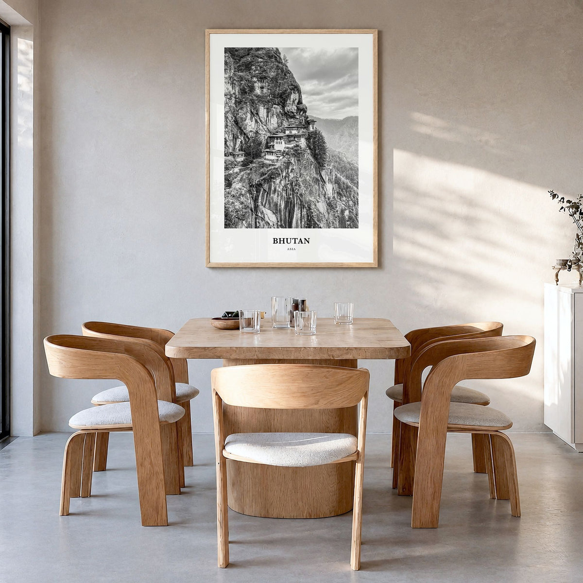 Bhutan Classic Poster in a natural wood frame, hanging in a dining room