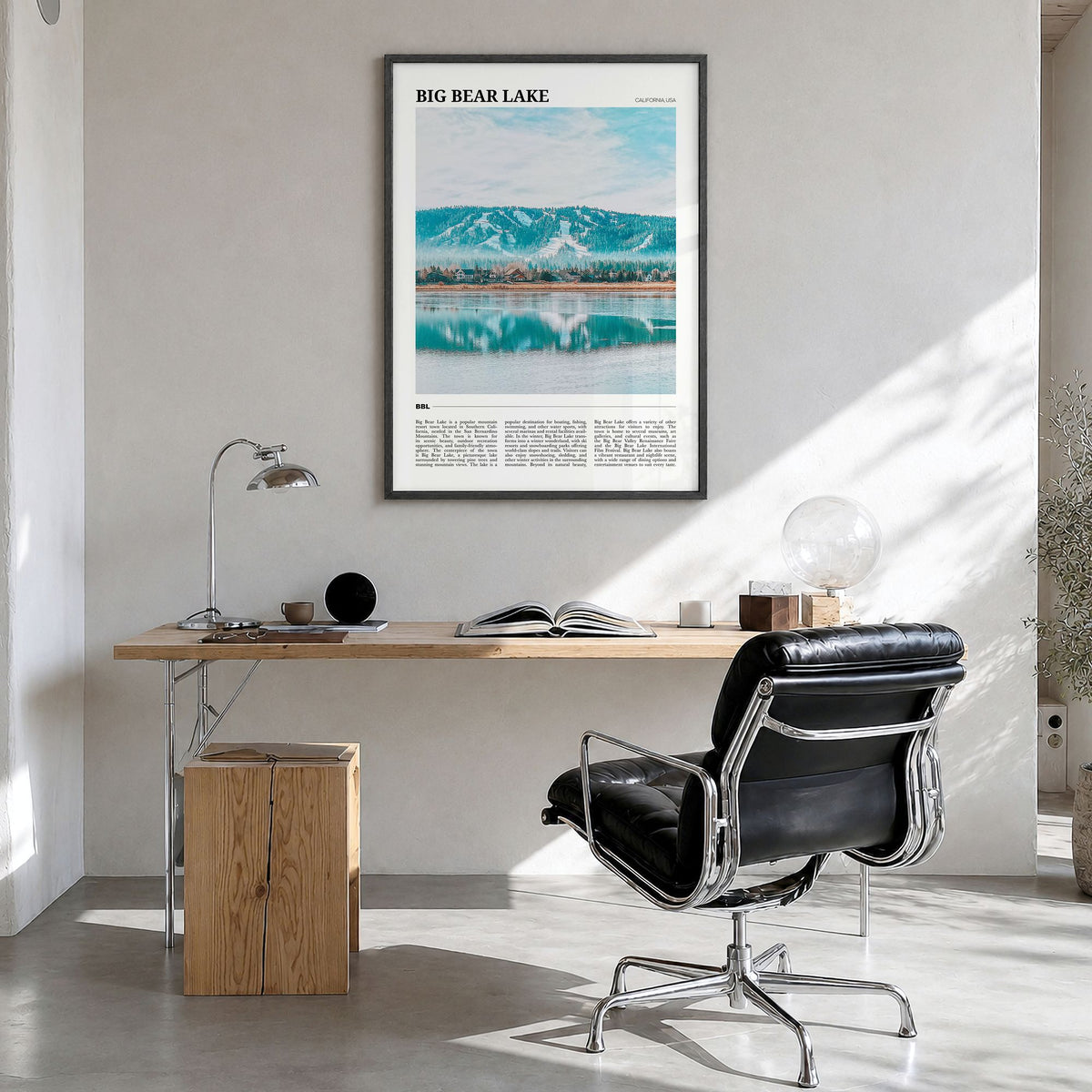 Big Bear Lake Travel Poster in a black wood frame, hanging in a bright home office