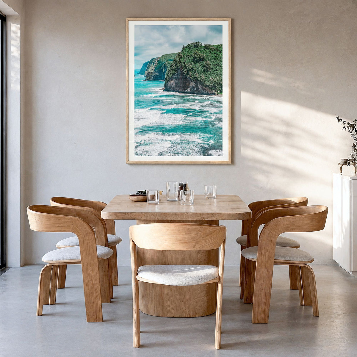 Big Island Photo Poster in a natural wood frame, hanging in a dining room, white border