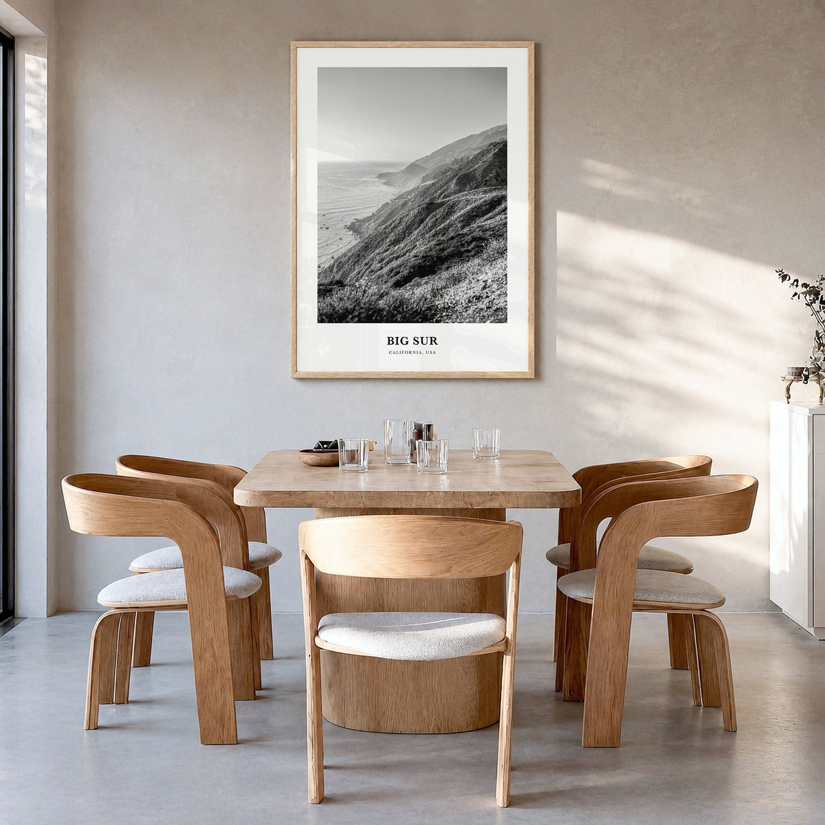 Big Sur Classic No 1 Poster in a natural wood frame, hanging in a dining room