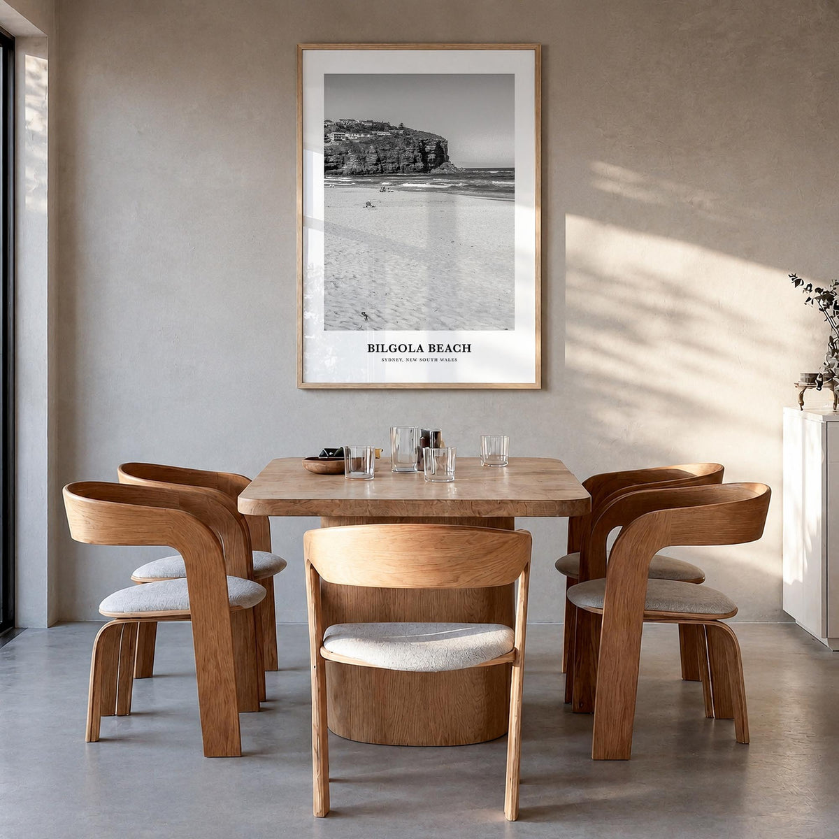 Bilgola Beach black & white classic poster of Australia – vertical wall art in natural wood frame, hanging on wall