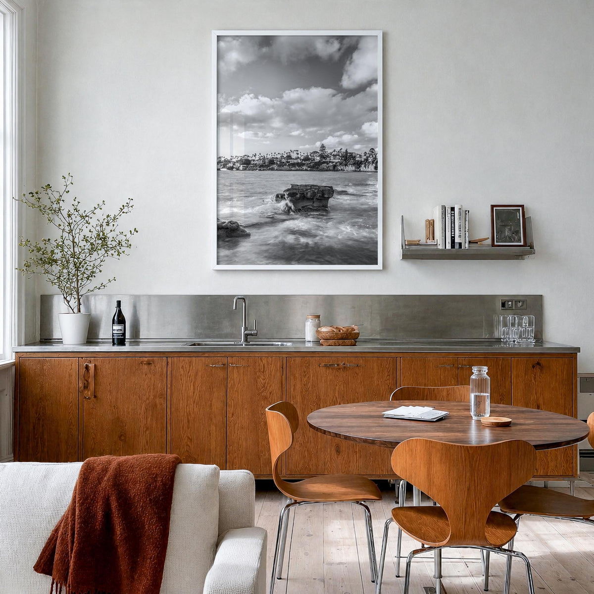 Bird Rock black & white photo poster of San Diego, California – vertical wall art in white wood frame, hanging on wall