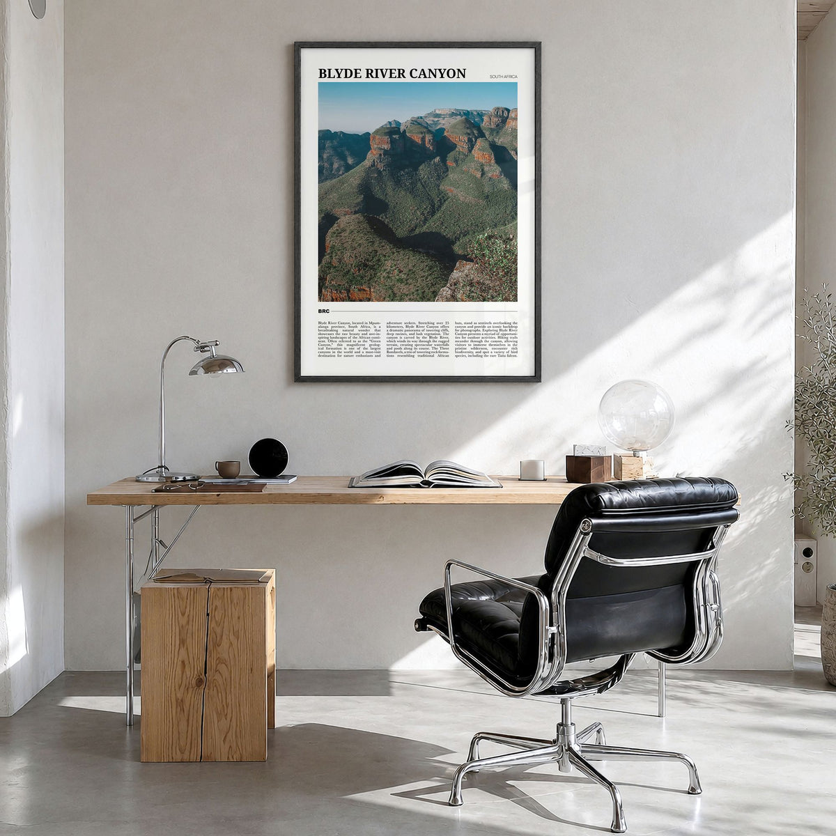 Blyde River Canyon Travel Poster in a black wood frame, hanging in a bright home office