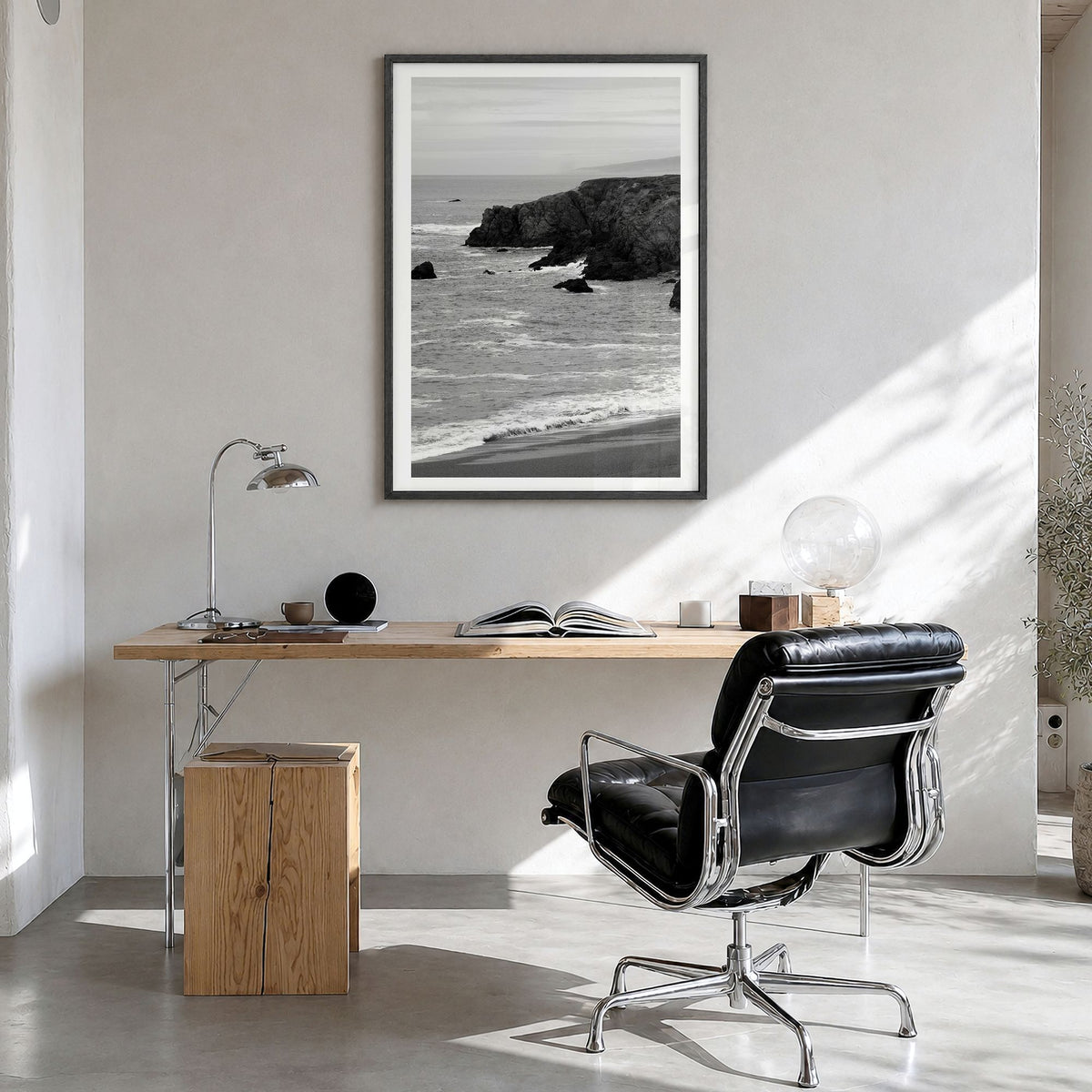 Bodega Bay Photo Poster in a black wood frame, hanging in a bright home office, white border