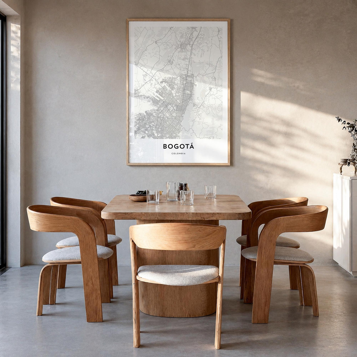 Bogotá black & white map poster of Colombia – vertical wall art in natural wood frame, hanging on wall