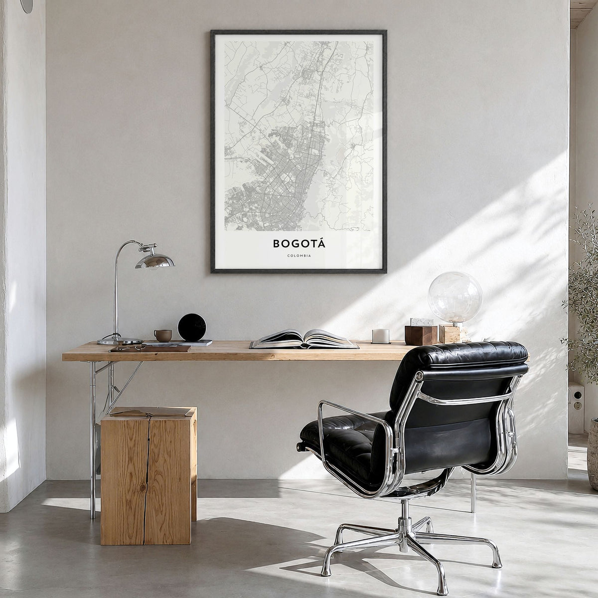 Bogotá Map Poster in a black wood frame, hanging in a bright home office