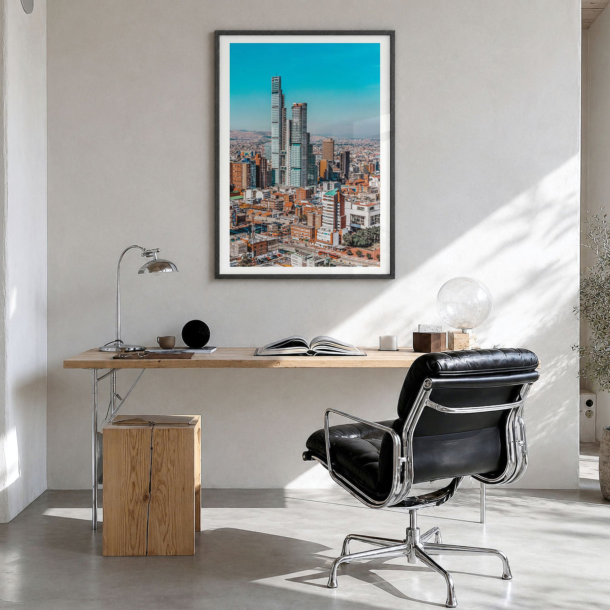Bogotá Photo No 1 Poster in a black wood frame, hanging in a bright home office, white border