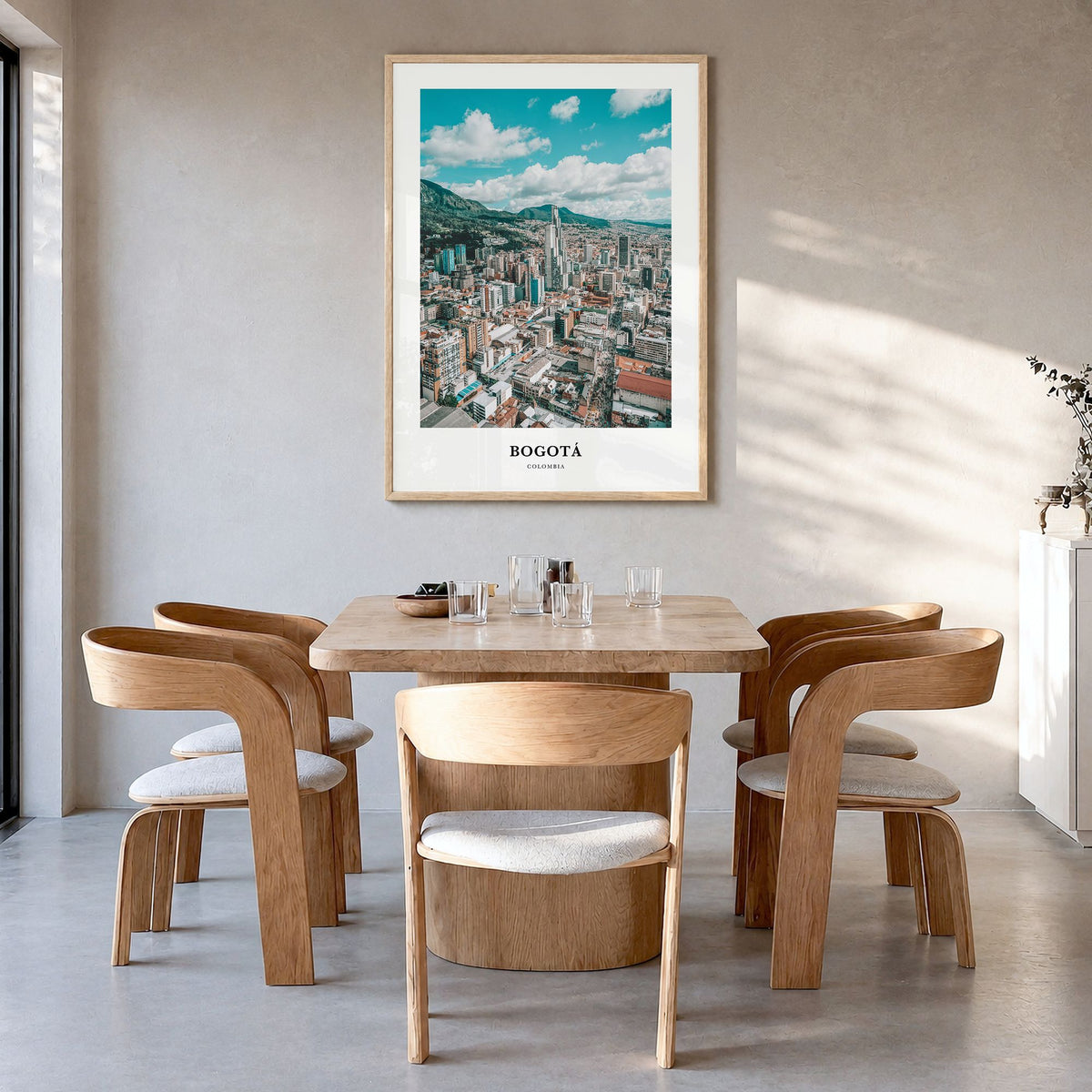 Bogotá Classic Poster in a natural wood frame, hanging in a dining room