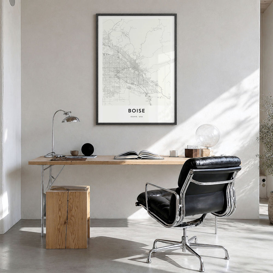 Boise Map Poster in a black wood frame, hanging in a bright home office