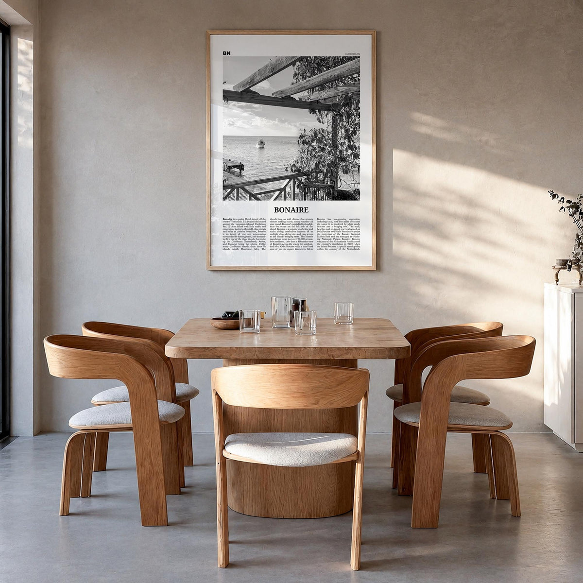 Bonaire black & white newspaper poster of Caribbean – vertical wall art in natural wood frame, hanging on wall
