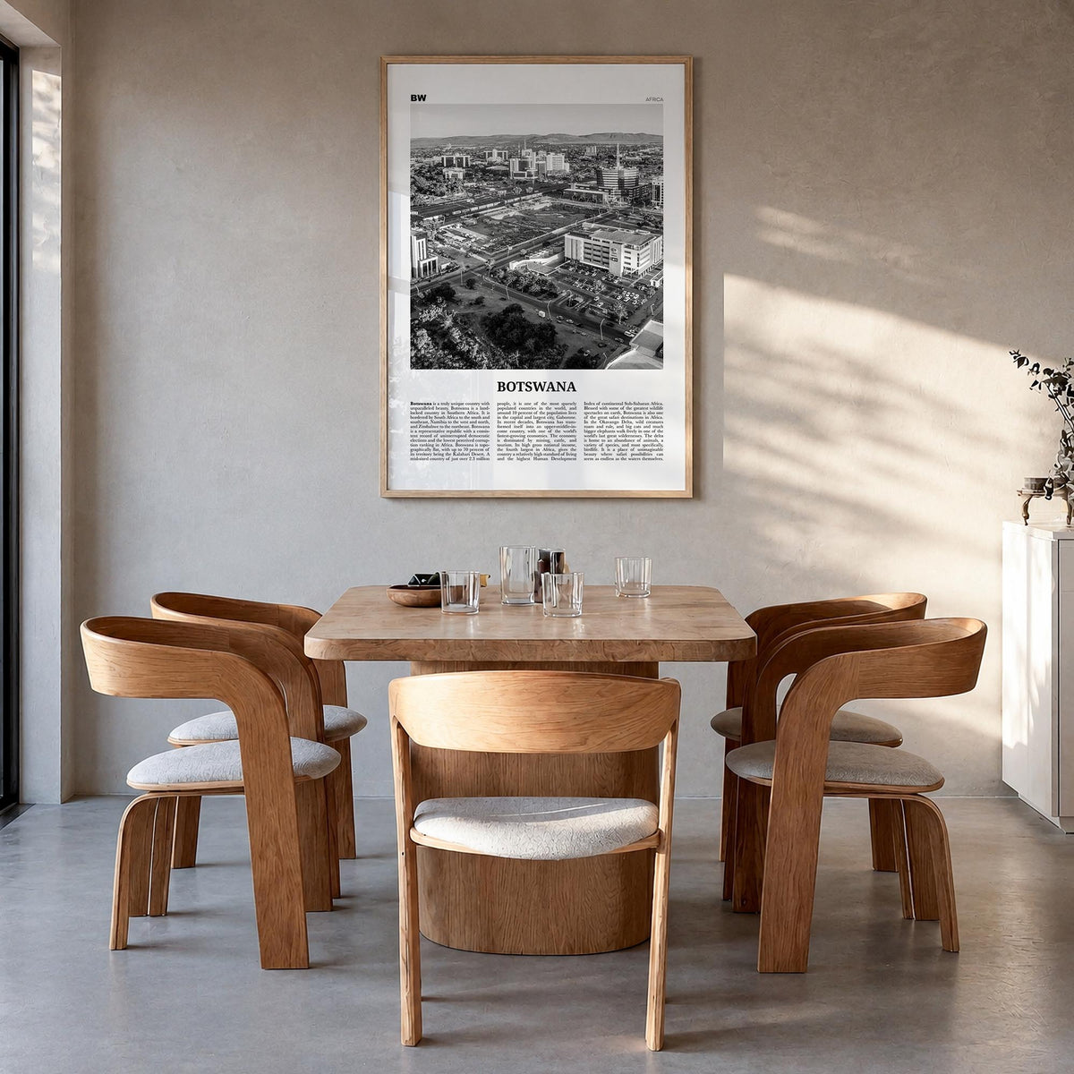 Botswana black & white newspaper poster of Africa – vertical wall art in natural wood frame, hanging on wall