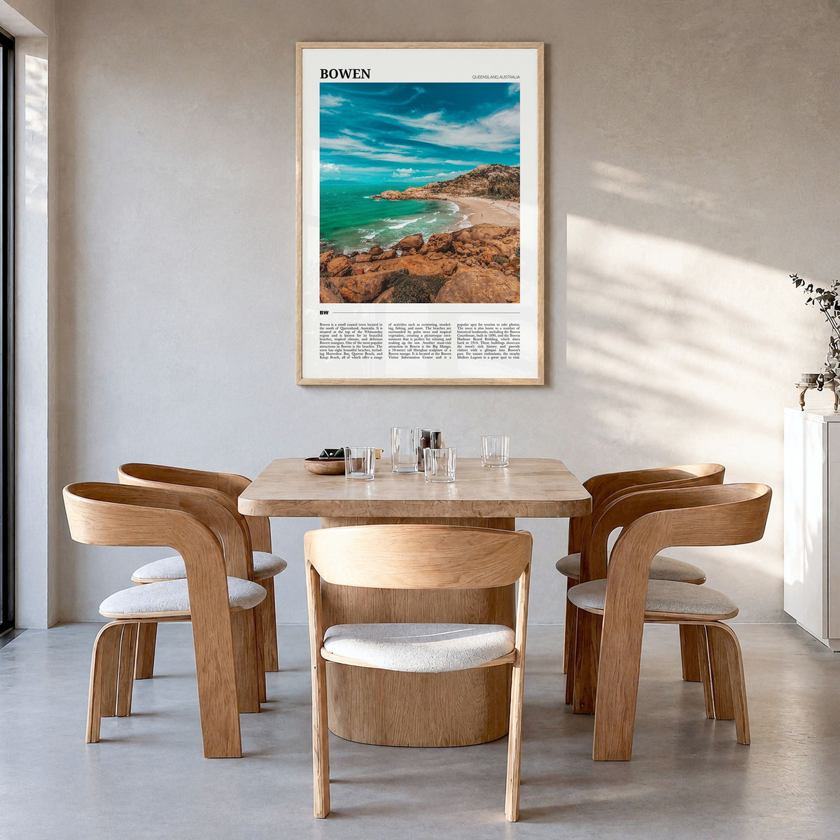 Bowen Travel Poster in a natural wood frame, hanging in a dining room