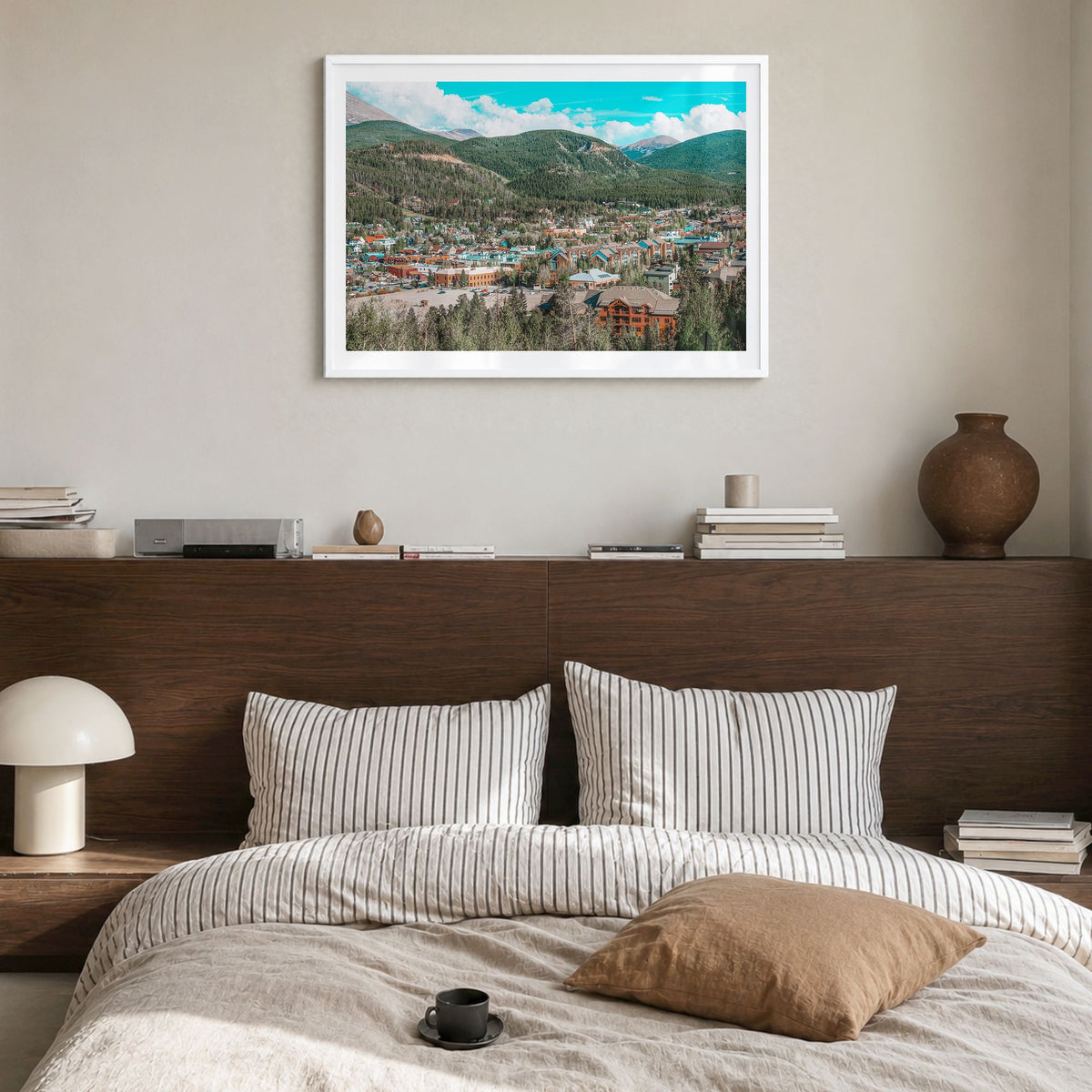Breckenridge Photo Poster in a white wood frame, hanging in a bedroom, white border