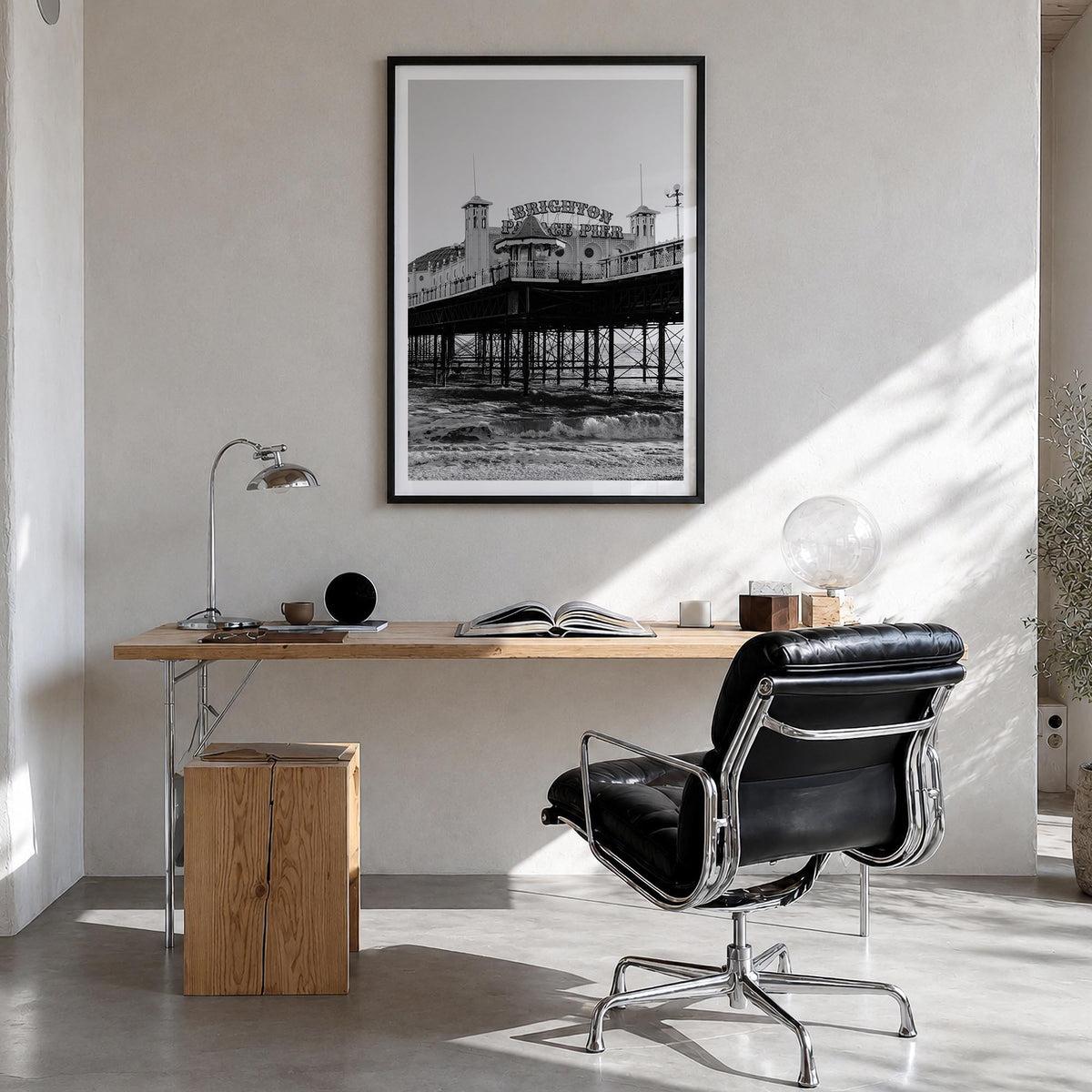 Brighton black & white photo poster of England, UK – vertical wall art in black wood frame with white border, hanging on wall