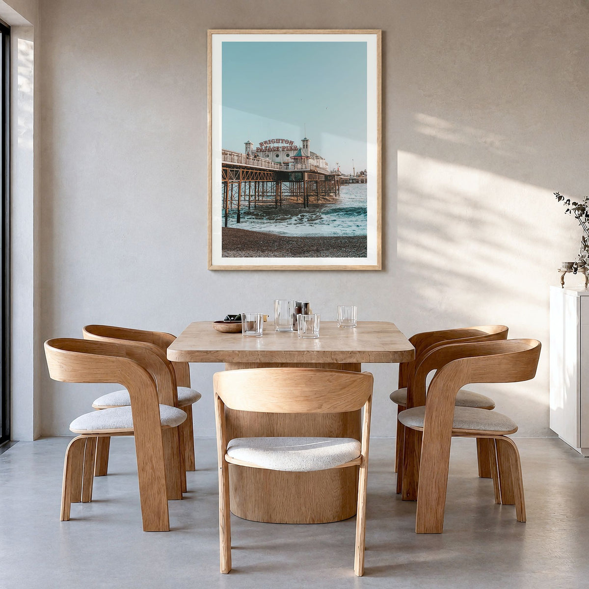 Brighton Photo Poster in a natural wood frame, hanging in a dining room, white border