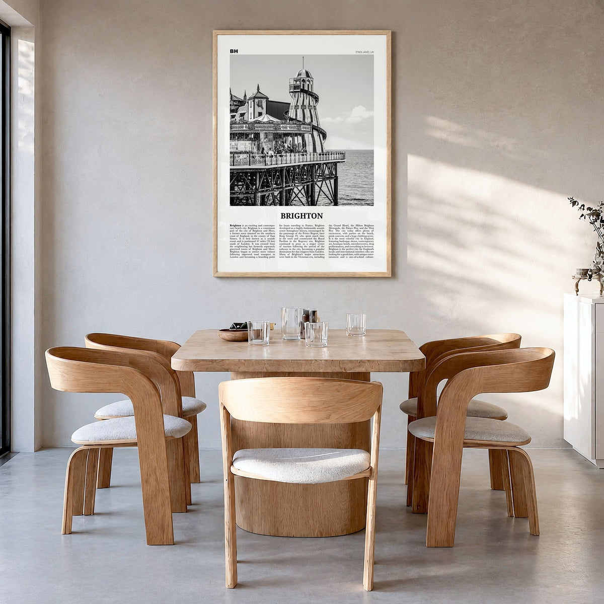 Brighton Newspaper Poster in a natural wood frame, hanging in a dining room