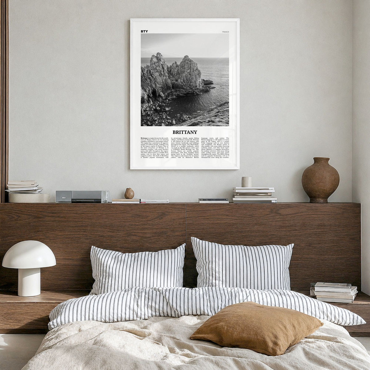 Brittany Newspaper Poster in a white wood frame, hanging in a bedroom