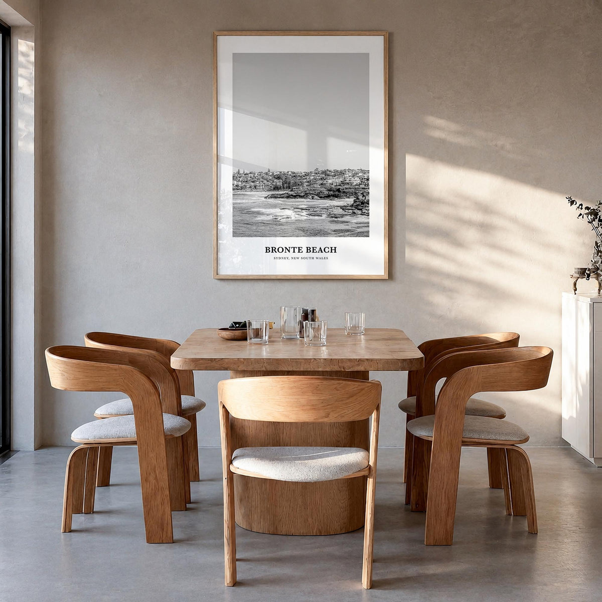 Bronte Beach black & white classic poster of Sydney, New South Wales – vertical wall art in natural wood frame, hanging on wa