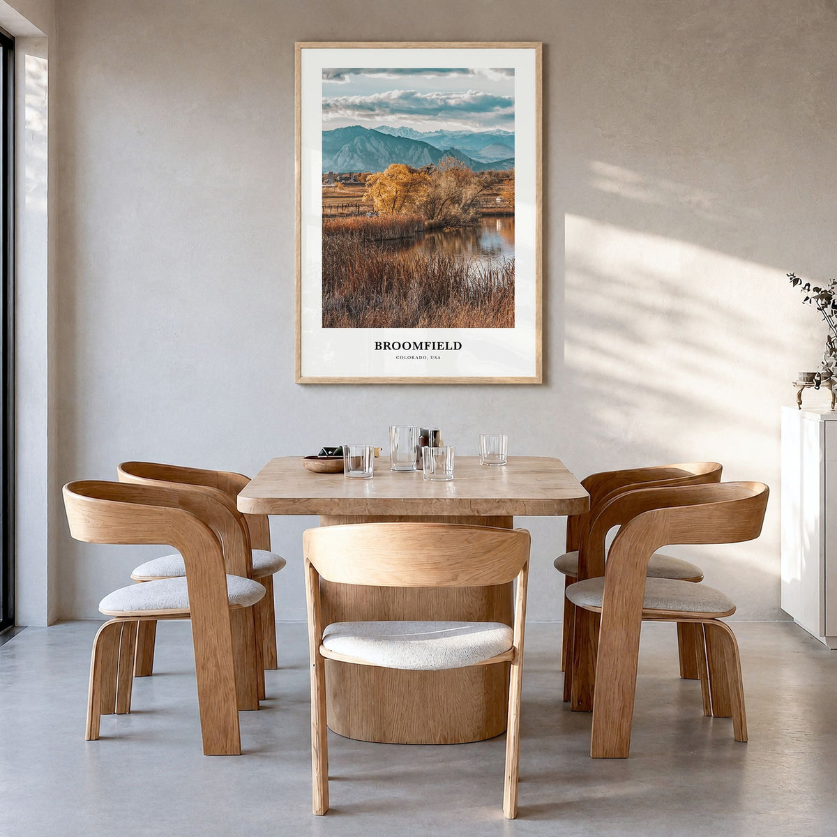 Broomfield Classic Poster in a natural wood frame, hanging in a dining room