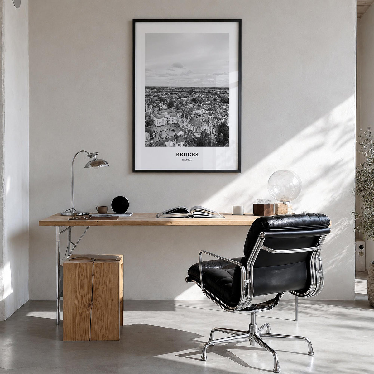 Bruges black & white classic poster of Belgium – vertical wall art in black wood frame, hanging on wall