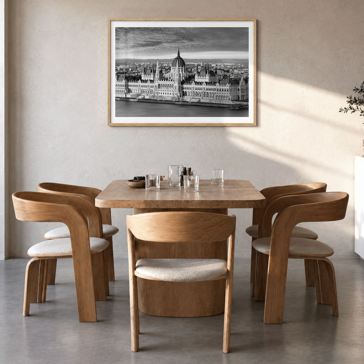 Budapest Photo Poster in a natural wood frame, hanging in a dining room, white border