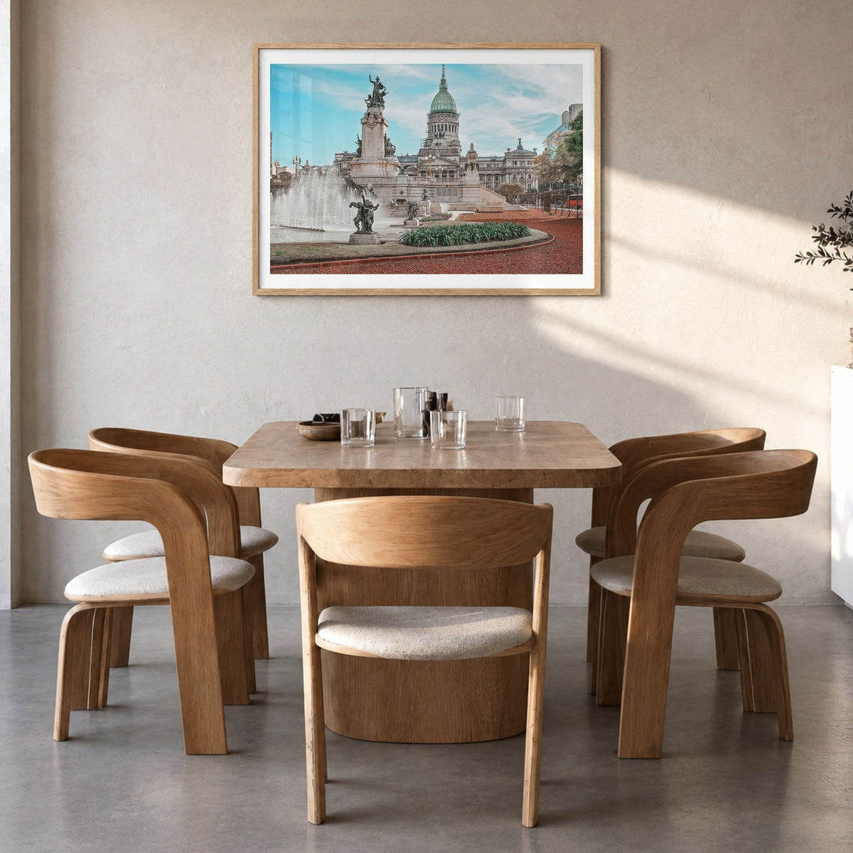 Buenos Aires Photo Poster in a natural wood frame, hanging in a dining room, white border