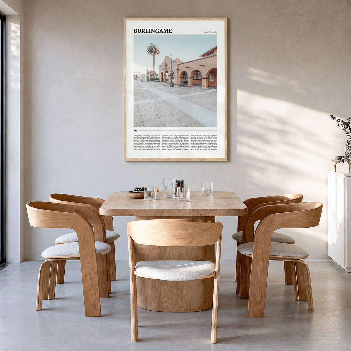 Burlingame Travel Poster in a natural wood frame, hanging in a dining room
