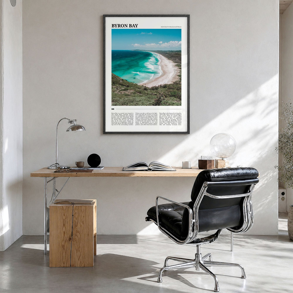 Byron Bay Travel No 2 Poster in a black wood frame, hanging in a bright home office