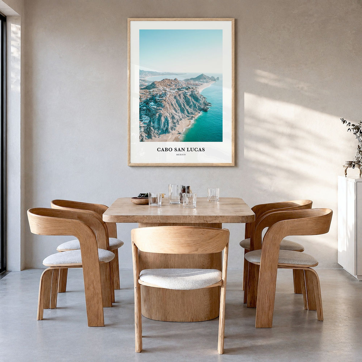 Cabo San Lucas Classic Poster in a natural wood frame, hanging in a dining room