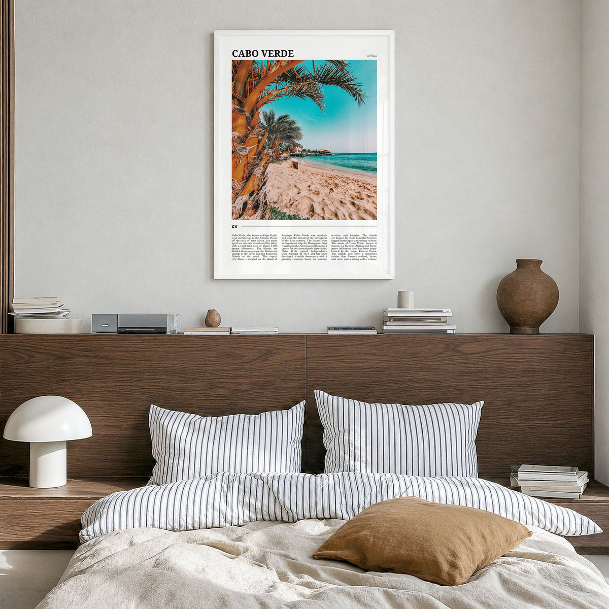 Cabo Verde Travel Poster in a white wood frame, hanging in a bedroom