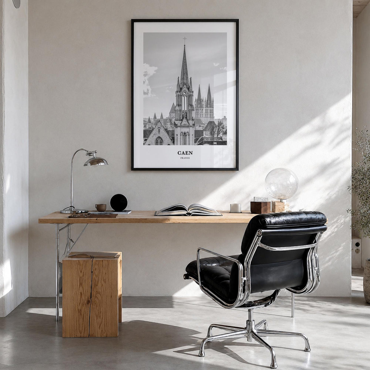 Caen no. 1 black & white classic poster of France – vertical wall art in black wood frame, hanging on wall